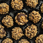 Closeup of chocolate nut coating on fig bite