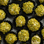Closeup of pistachio-coated fig in 6 flavor mix